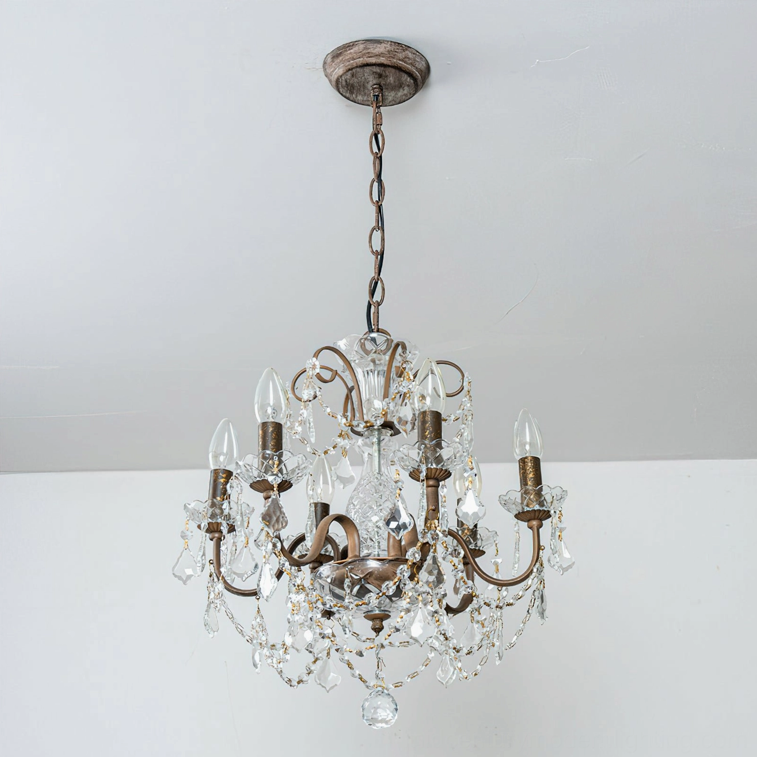 Full Fauna crystal chandelier lineup showing multiple finish options (gold, silver, rust) with clear crystals on neutral background