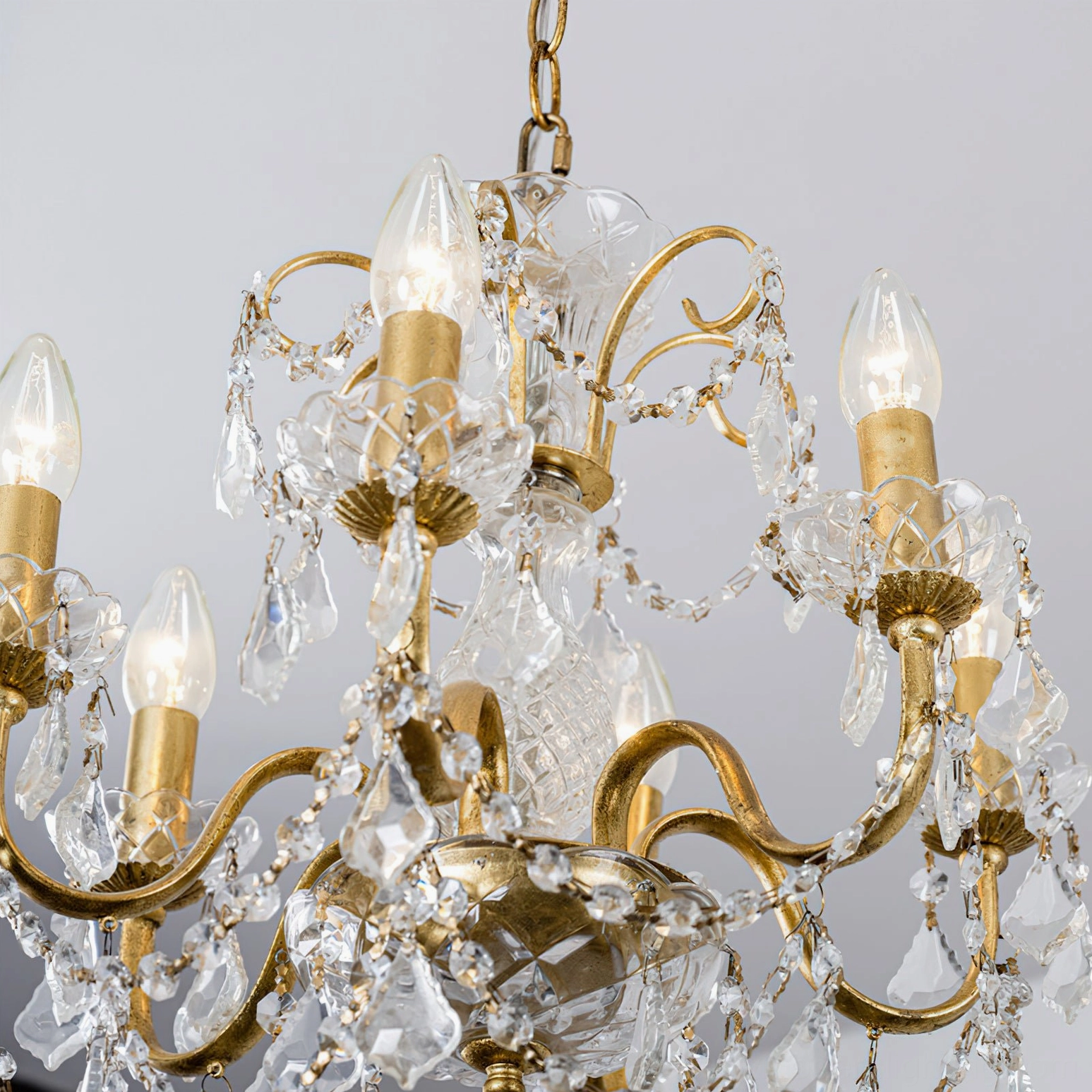 Fully lit Fauna crystal chandelier with balanced light spread showing shadow-free illumination in residential dining space