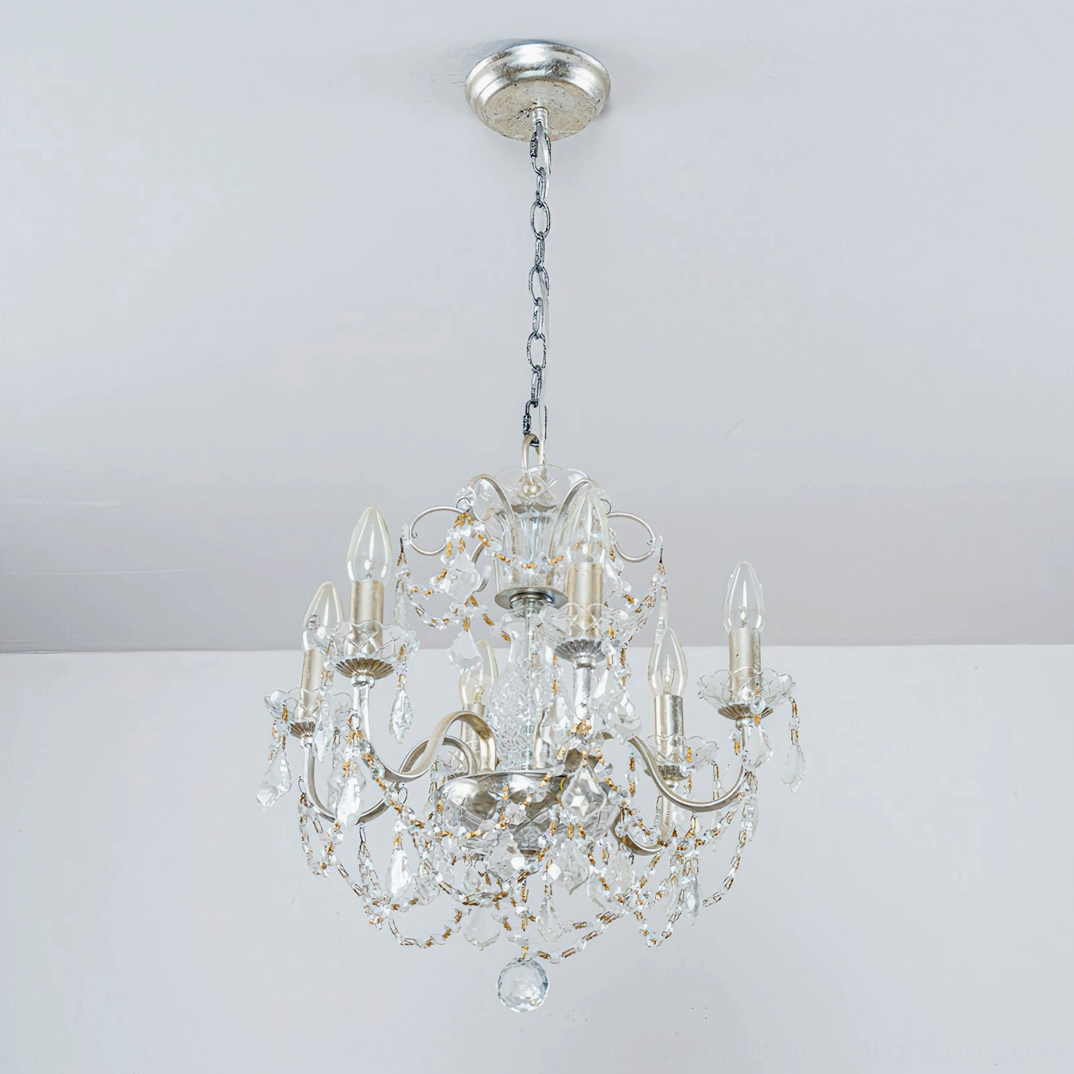 Unlit silver-finish Fauna crystal chandelier showing detailed crystal structure and sleek metal framework on white background