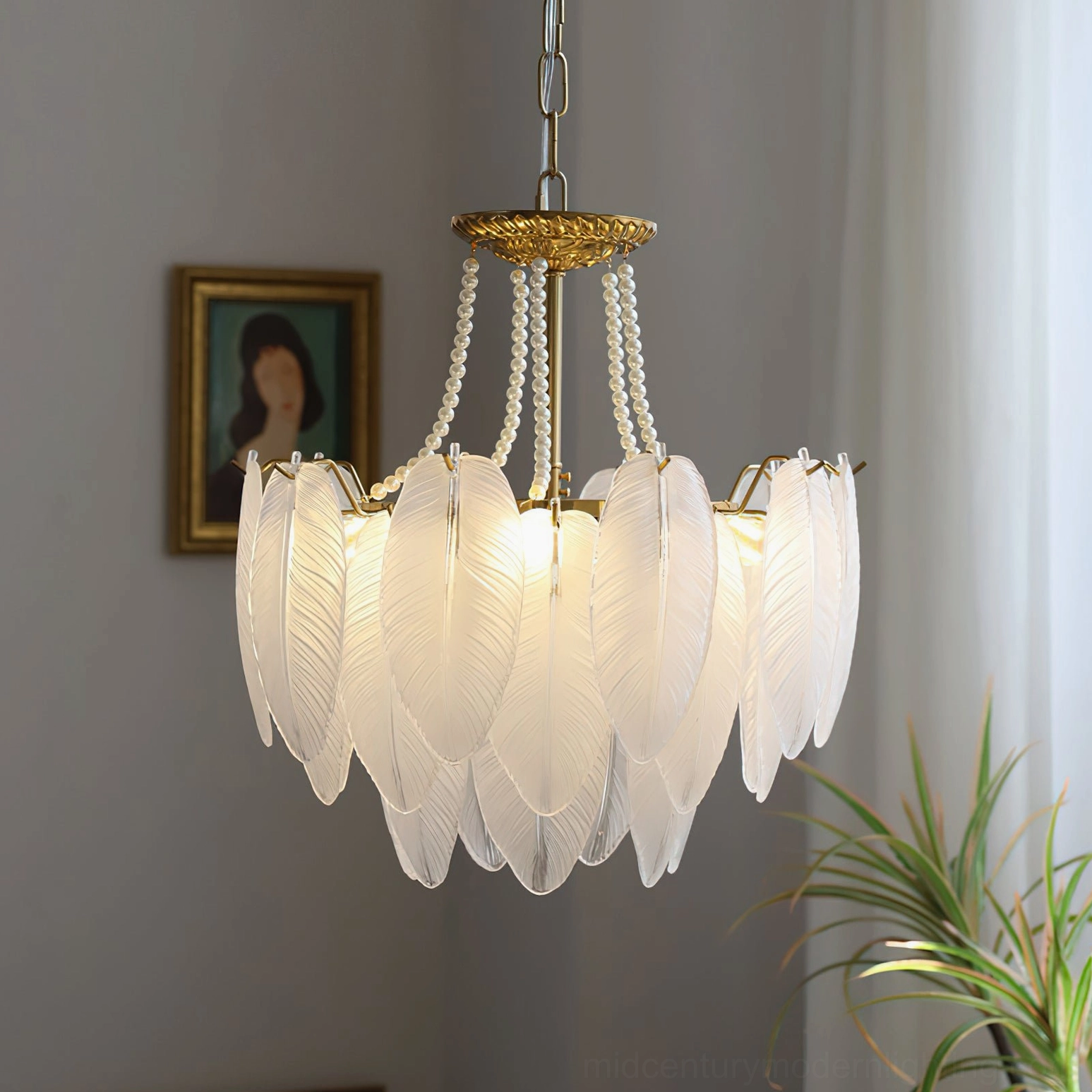 Feathered glass chandelier showing all four available sizes arranged to display range from intimate to grand interior scales
