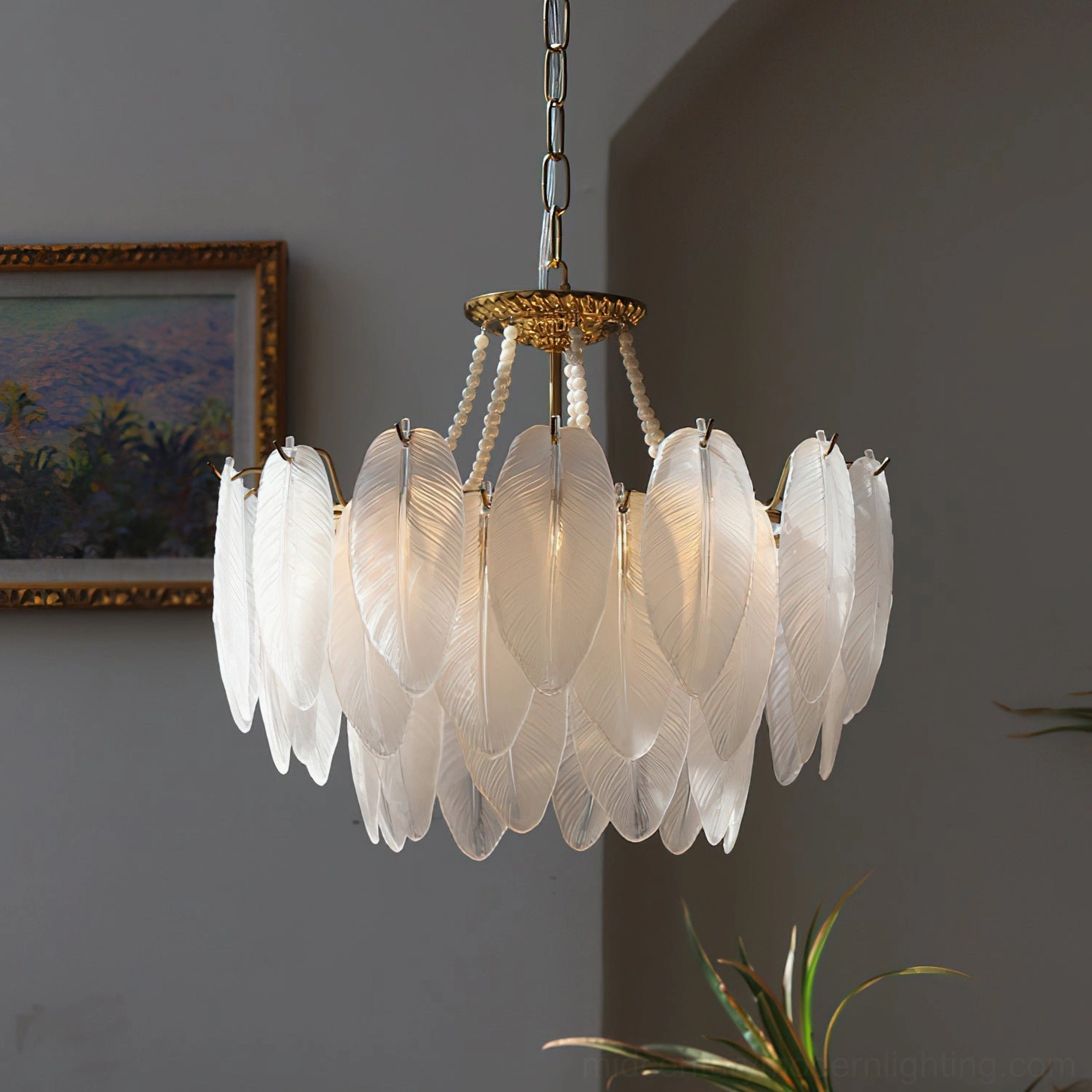 Feathered glass chandelier demonstrating scale and proportion in contemporary interior space with neutral furnishings and modern aesthetic