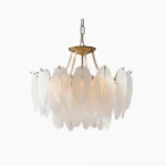 Feathered glass chandelier with gold frame displayed against white studio background, showcasing frosted glass feather-shaped elements and brass hardware