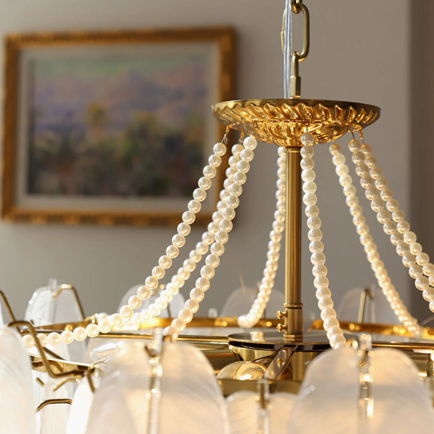 Feathered glass chandelier with various size options displayed side-by-side showing diameter and height proportions for different room scales