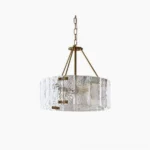 Fenoullet rippled glass chandelier with brushed gold frame, frontal view on white background showing textured drum pendant design