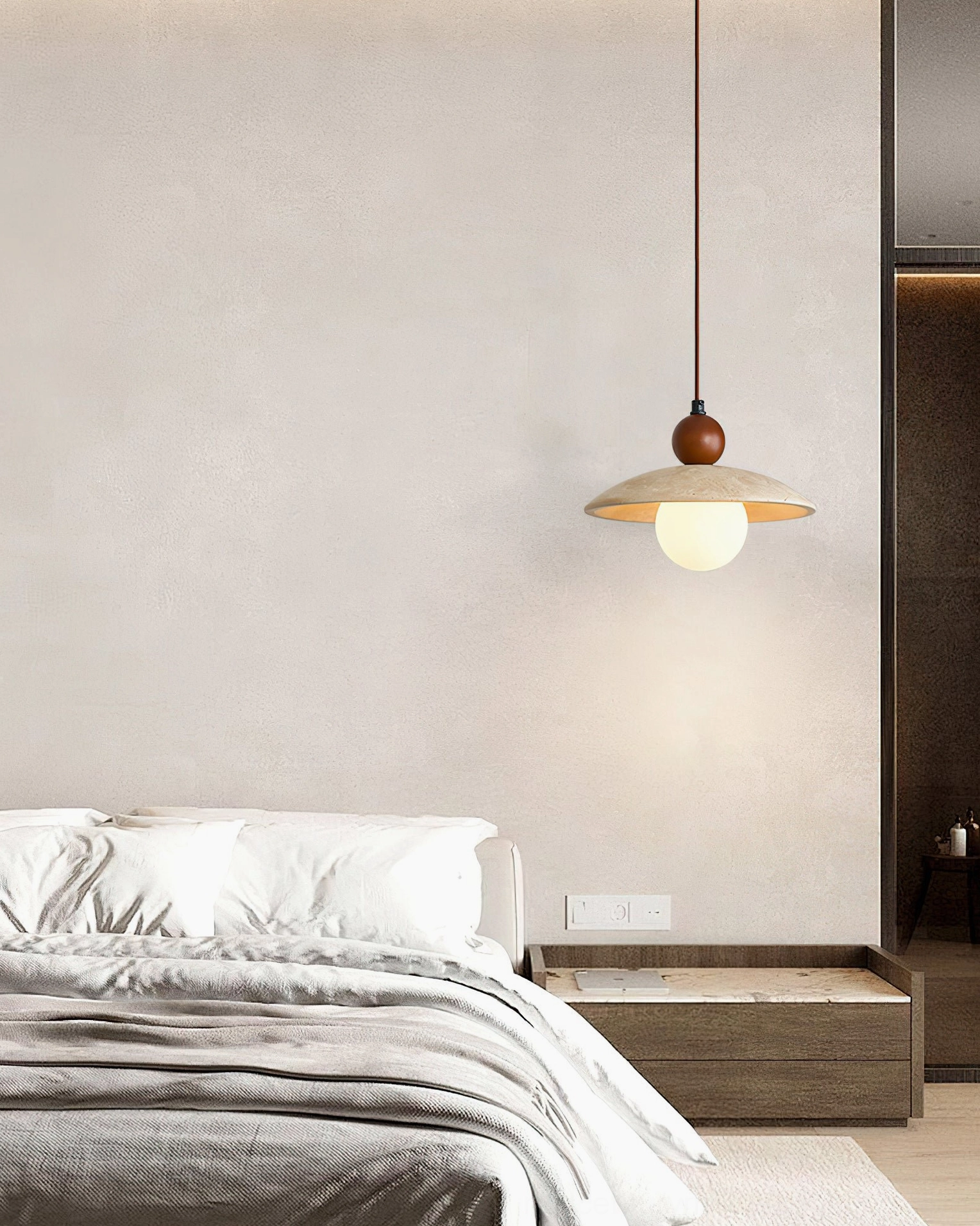 Ferox pendant light in minimalist Japanese-style bedroom creating soft warm lighting above bed