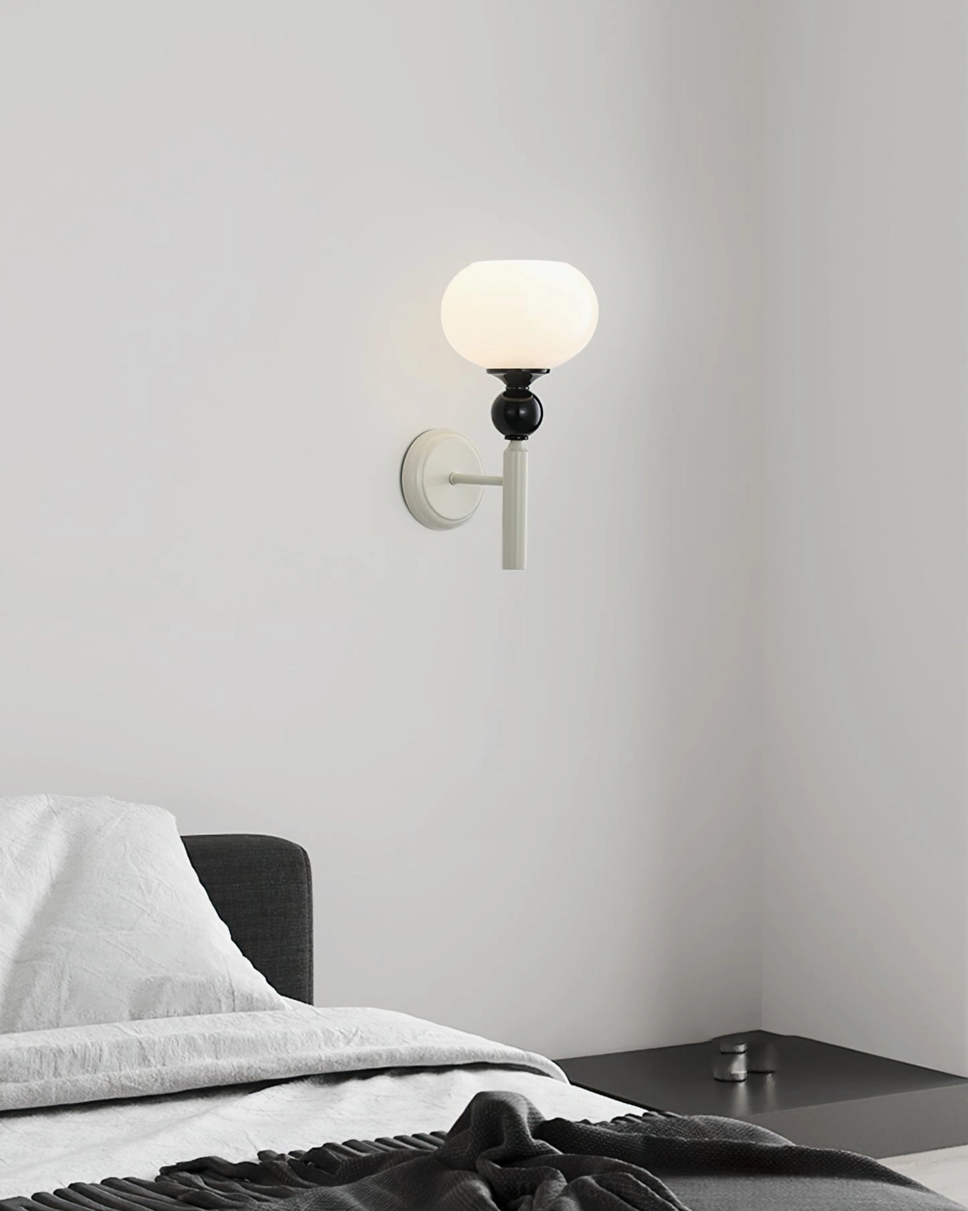 Feya minimalist wall sconce in modern bedroom interior providing accent lighting and ambiance