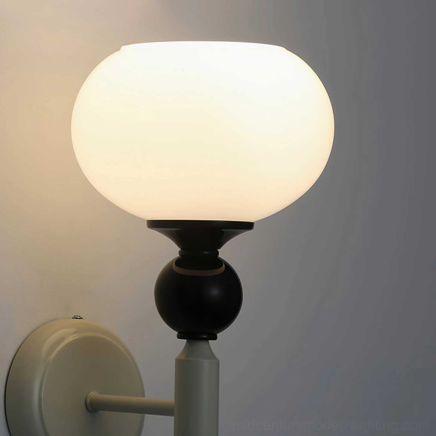 Feya globe wall lamp illuminated with soft warm glow demonstrating ambient lighting quality