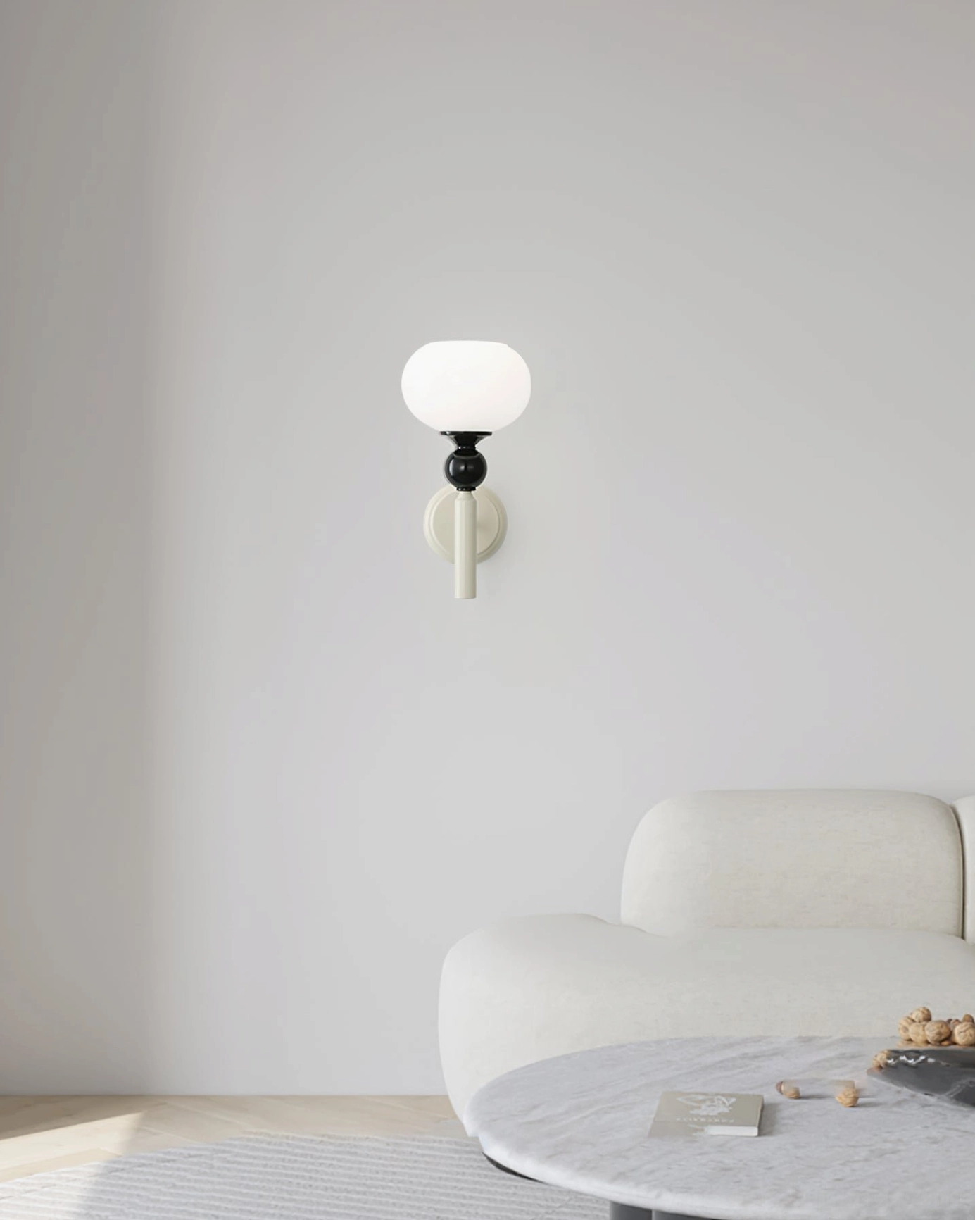Feya wall lamp off-white finish variant with matte metal surface and geometric spherical shape