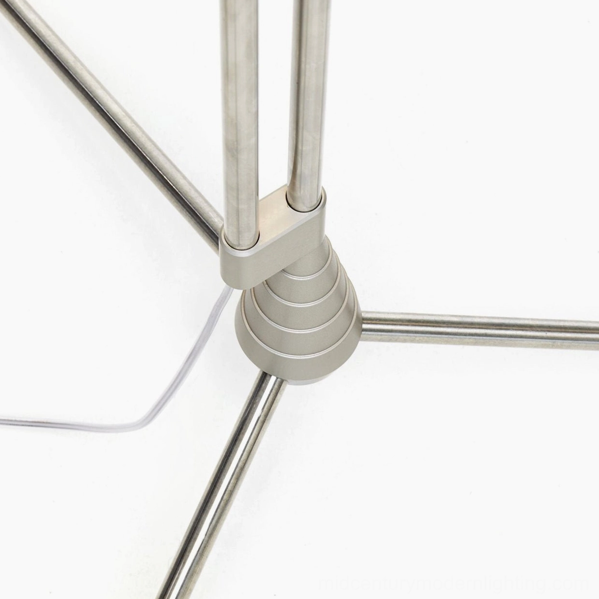Filigree floor lamp industrial-minimalist design with metal frame and contemporary wire-work artistry