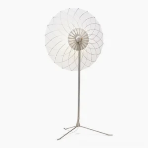 Modern filigree floor lamp displaying delicate metal lattice pattern and round fabric shade in minimalist composition