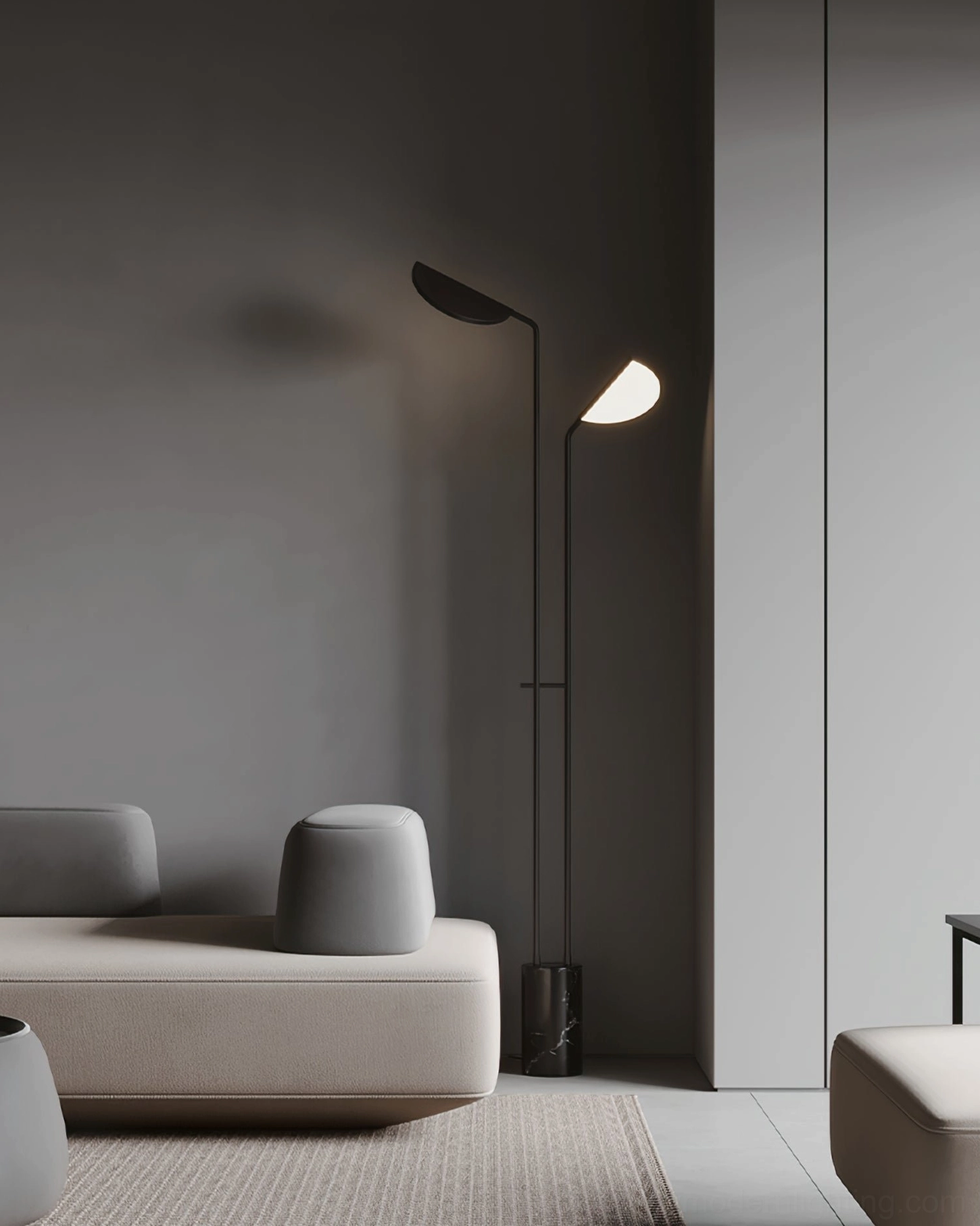 Pair of black Filo sculptural floor lamps with warm illumination in minimalist living room - side view of dual lamps