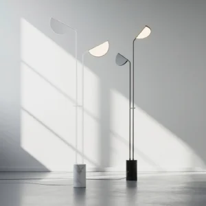 Pair of Filo floor lamps in white and black finishes in sunlit contemporary interior space - three-quarter view showing minimalist design