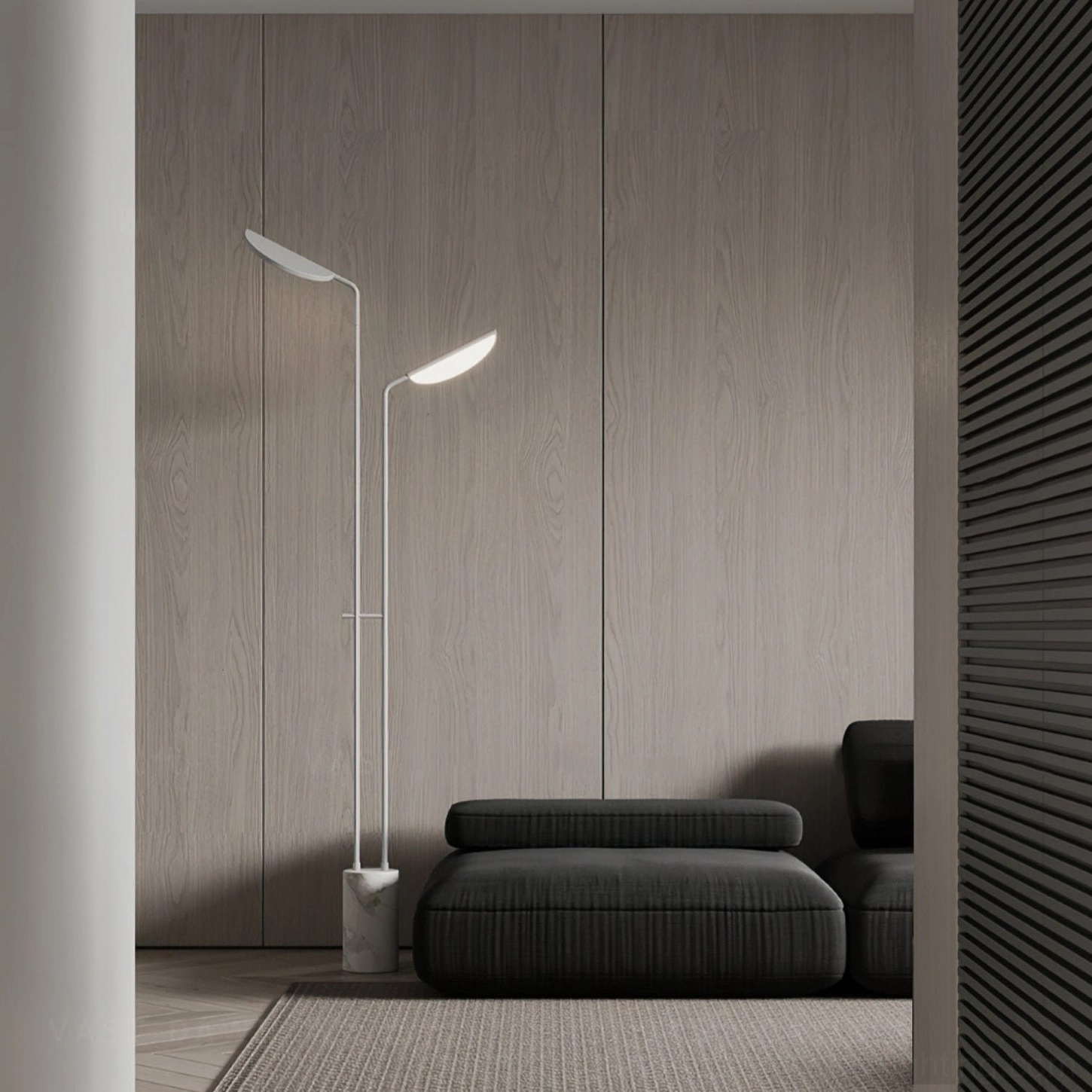 White Filo sculptural floor lamp beside dark modern sofa - side angle view in contemporary minimalist living room