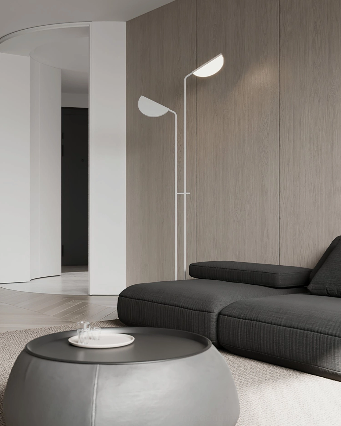 White Filo minimalist floor lamp with organic leaf design in modern living room with dark sectional sofa - three-quarter interior view