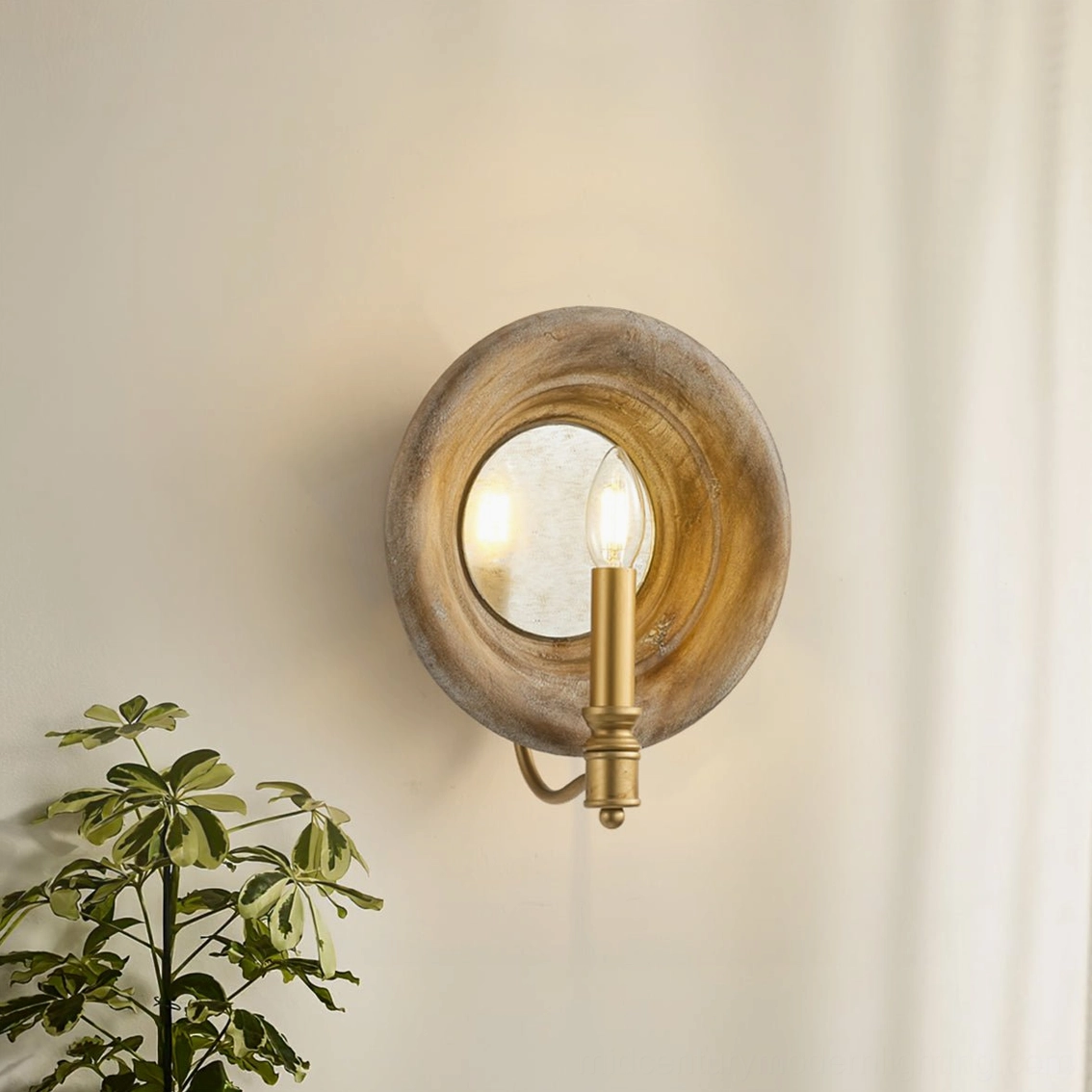 Finn wooden wall lamp in rustic farmhouse setting with potted plant and natural interior light