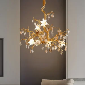 Fiori sculptural chandelier illuminated, eye-level perspective showing warm brass and crystal detail