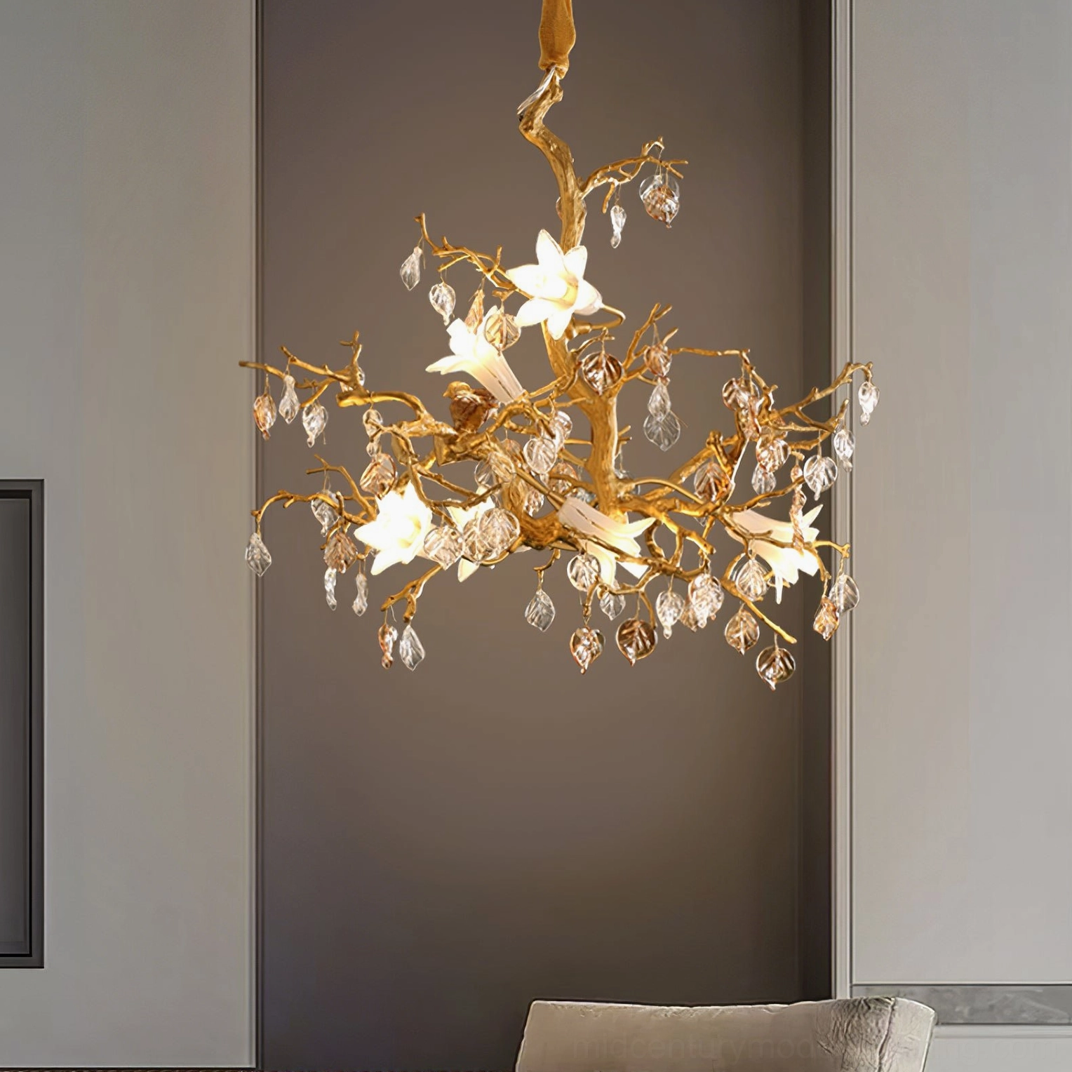Fiori sculptural chandelier illuminated, eye-level perspective showing warm brass and crystal detail