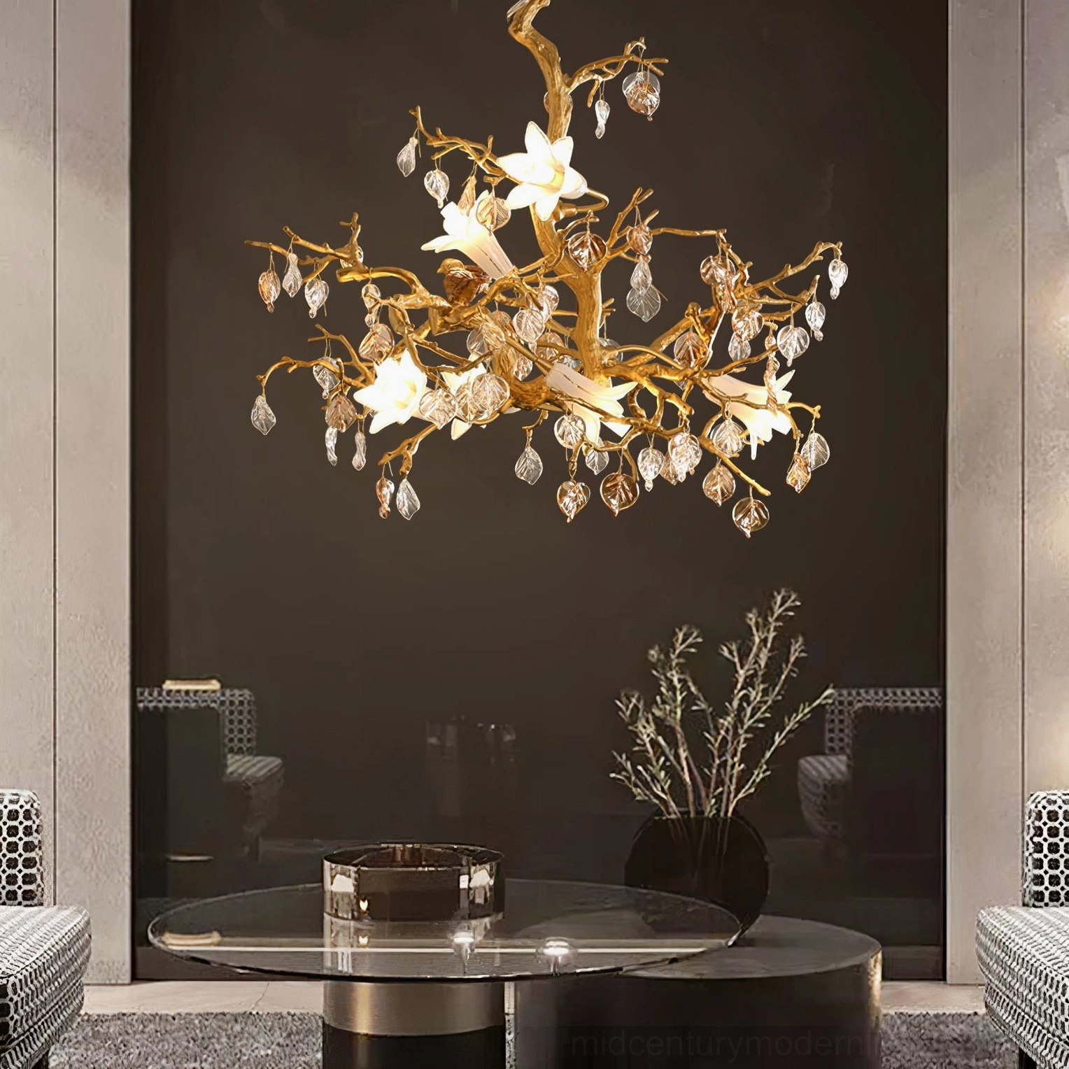 Fiori sculptural chandelier in modern living room with glass coffee table and warm ambient lighting