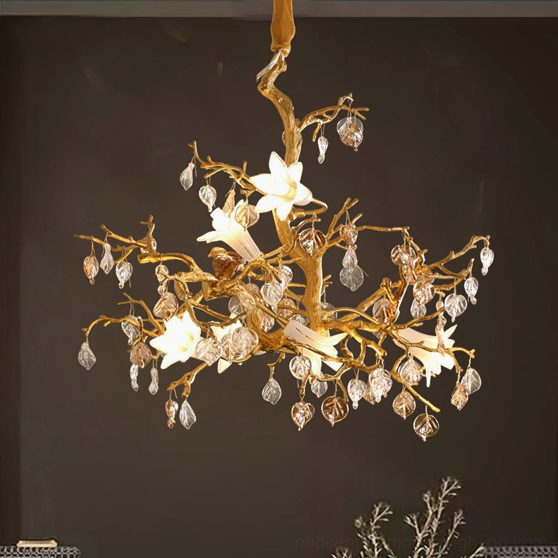 Illuminated Fiori branch chandelier from low angle, showing glowing flowers and crystal drops, gold metal design