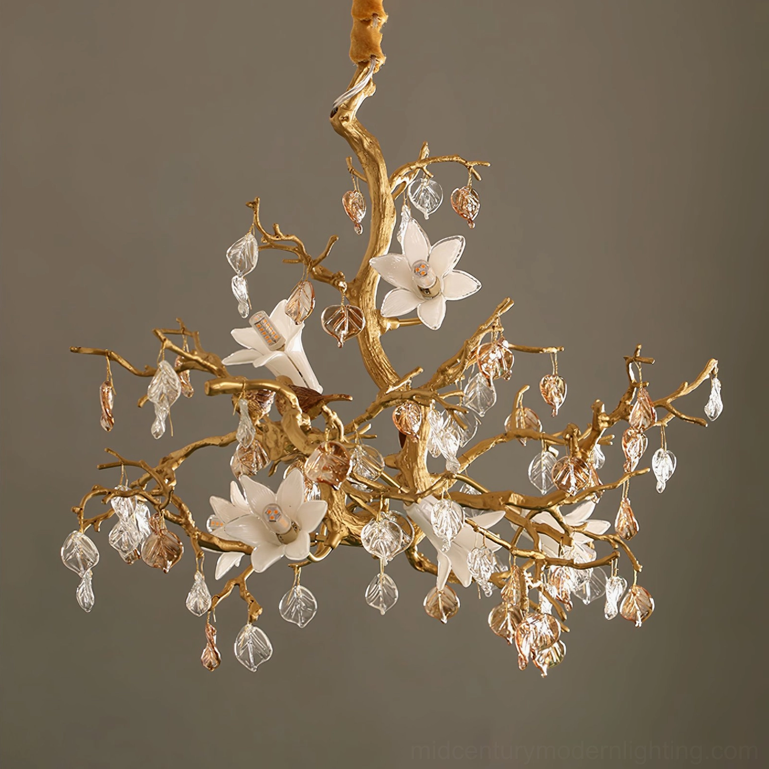 Fiori brass floral chandelier with white magnolia flowers and mixed crystal pendants, dark background