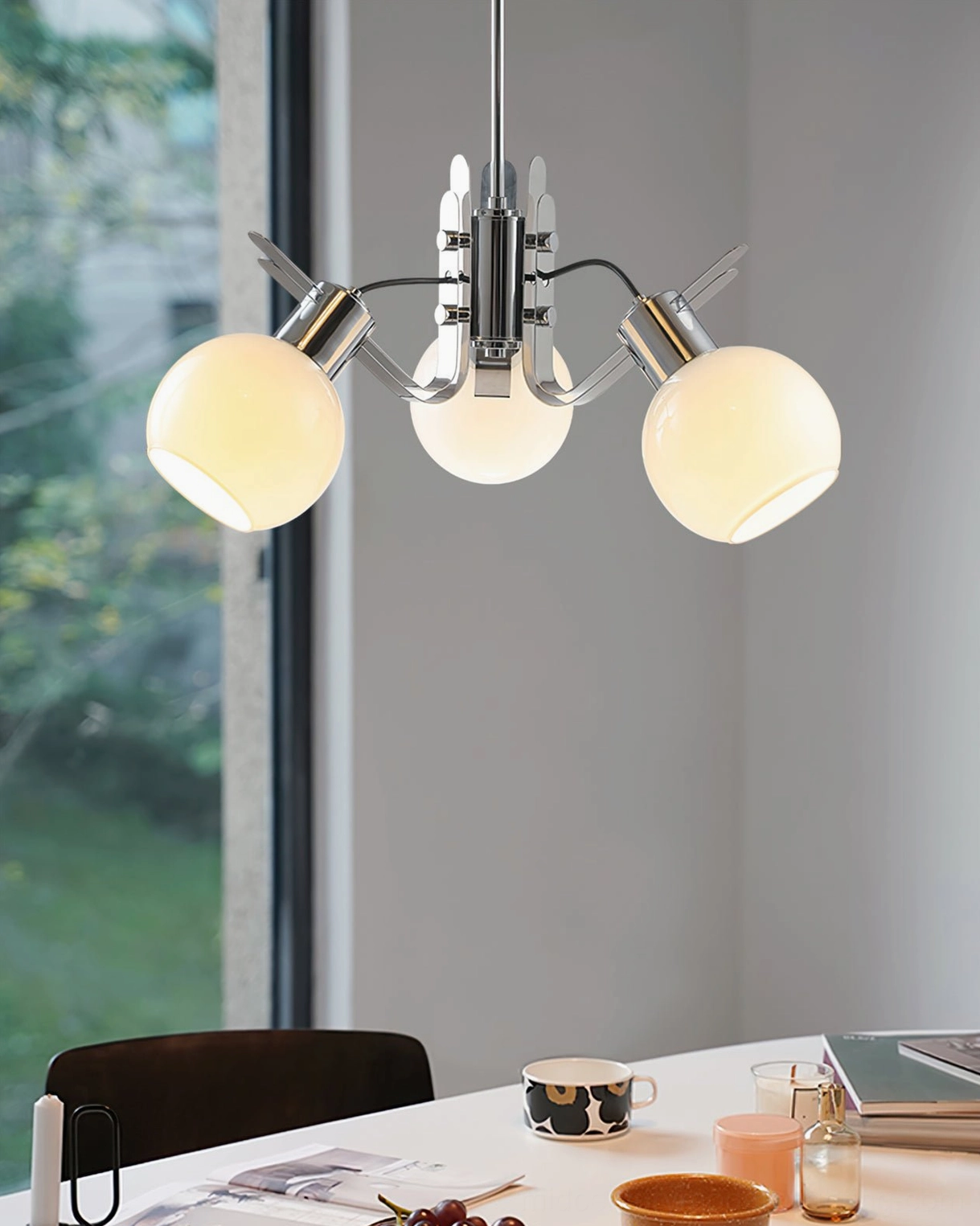 Five-head geometric glass chandelier with extended chrome suspension rod in contemporary space