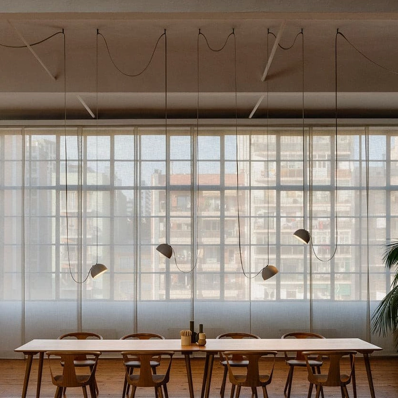 Five-head leather cord pendant lamp cluster in commercial dining space with floor-to-ceiling windows