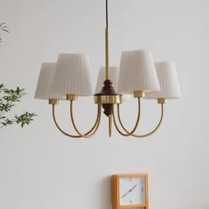 5-head mid-century modern wood chandelier with pleated fabric shades in contemporary interior