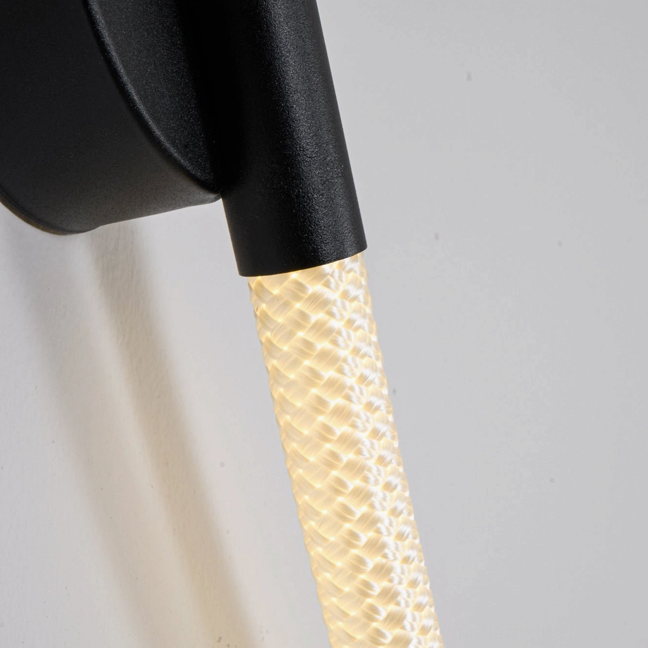 Flecto Tube wall lamp extended model showing full-length warm LED illumination and architectural impact