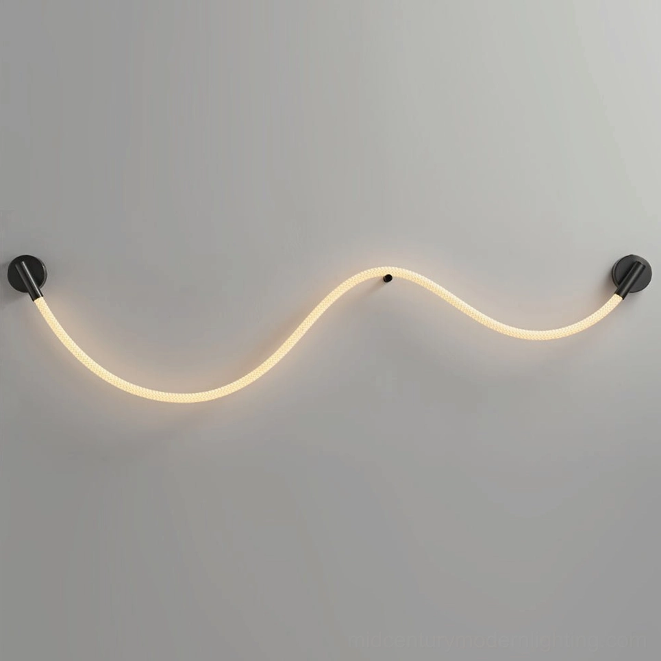 Flecto Tube Model B black and warm light wall lamp extended length installed in living room feature wall