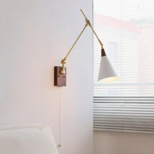 Mid-century modern swing arm wall lamp illuminated in bedroom setting showing warm light ambiance and minimalist design aesthetic