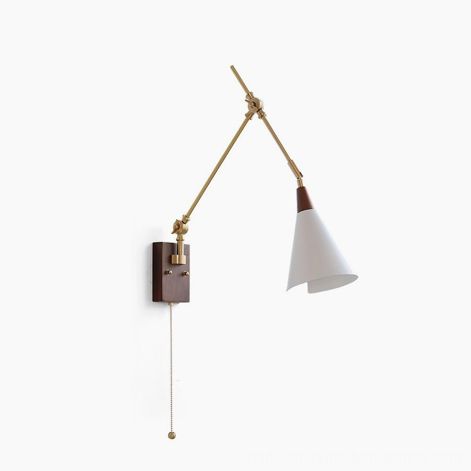 Fleka swing arm wall lamp studio view featuring brass articulated arms, walnut mounting plate, and white conical shade against white backdrop