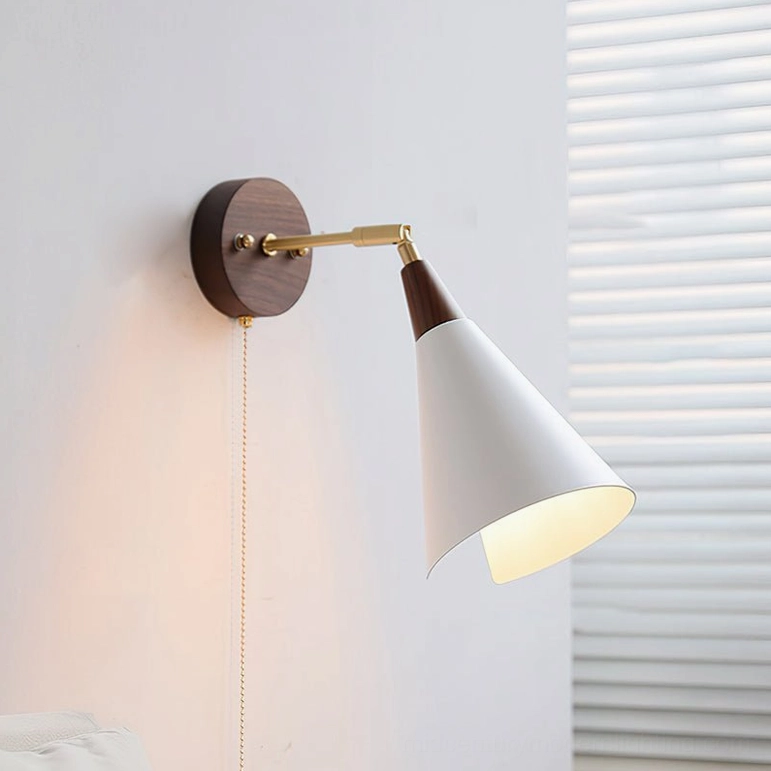 Fleka wall lamp with traditional wall switch control option, complete assembly view showing brass arm articulation and wood base