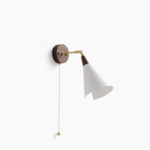 Fleka mid-century modern wall sconce with adjustable brass arm and walnut wood base, front view against white studio background