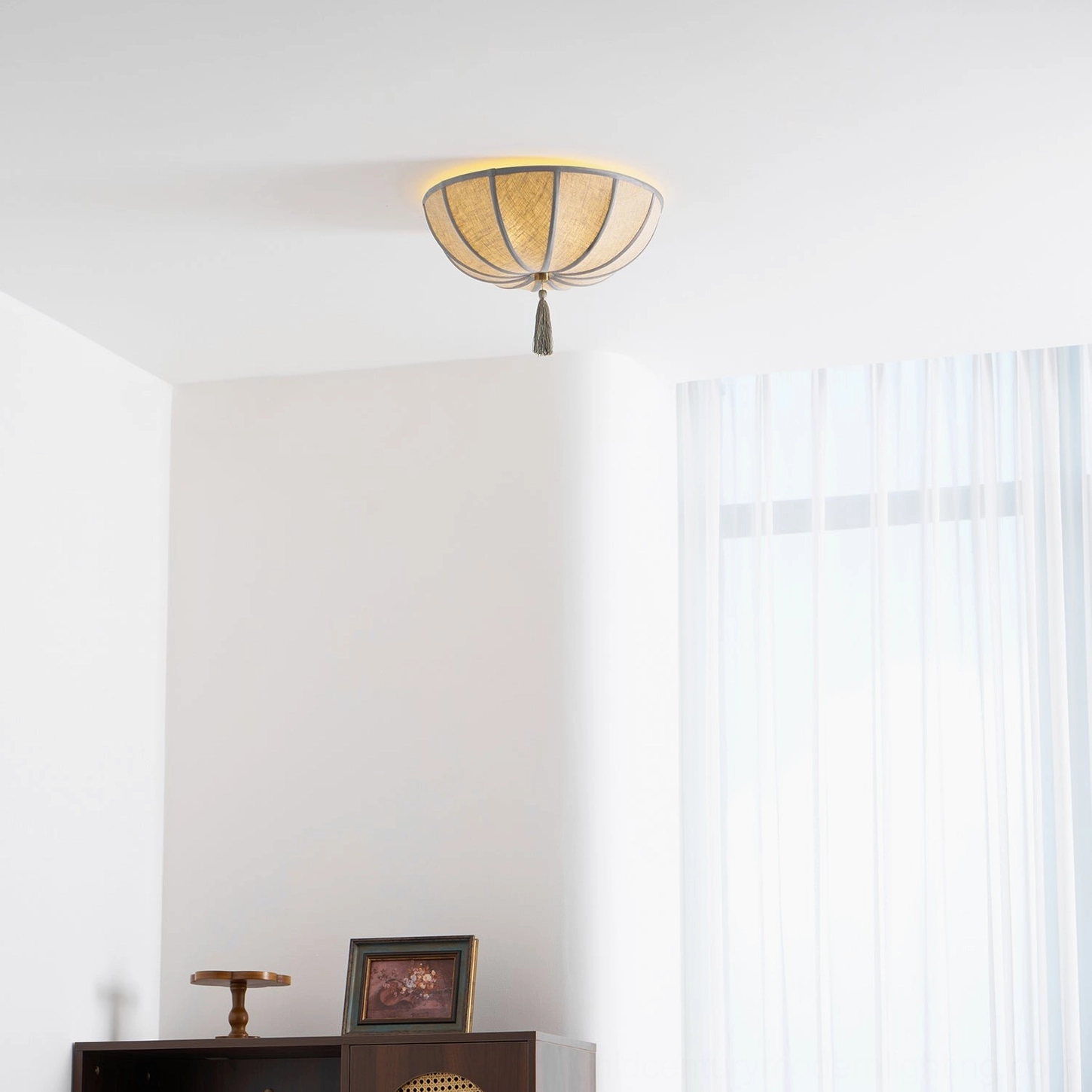 Fleur ceiling light fixture in dining room setting creating elegant ambient lighting for meals