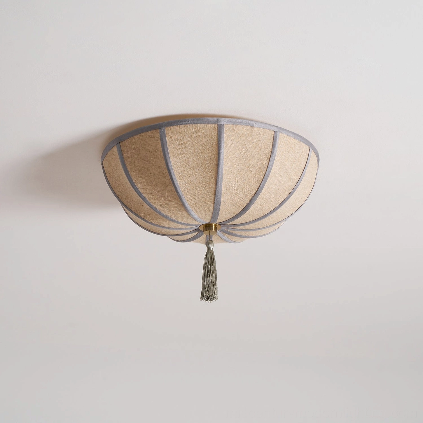 Fleur flush-mount ceiling light fixture with polished gold hardware and decorative tassel center detail