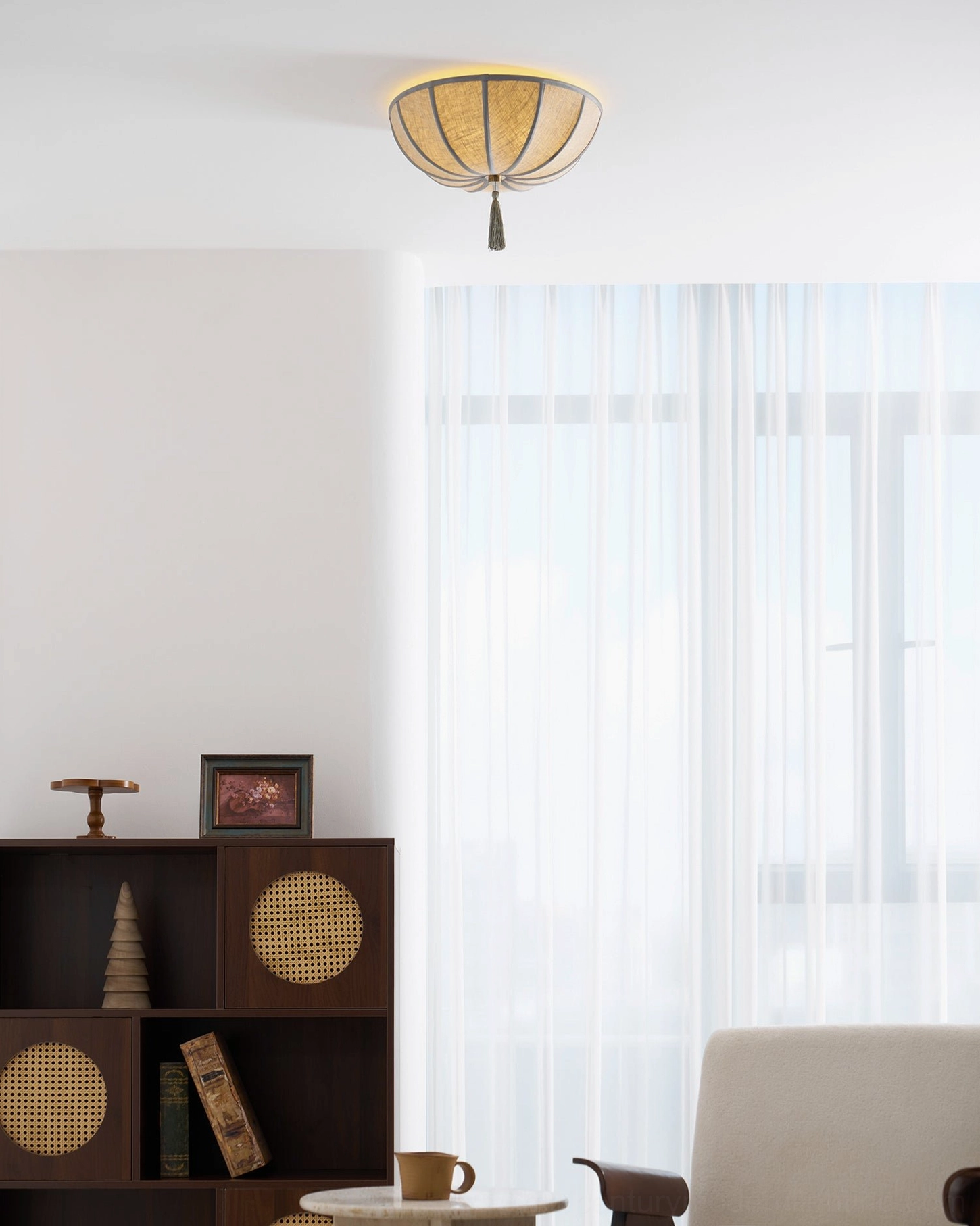 Fleur vintage fabric ceiling light illuminated in warm interior setting showing light diffusion and ambiance