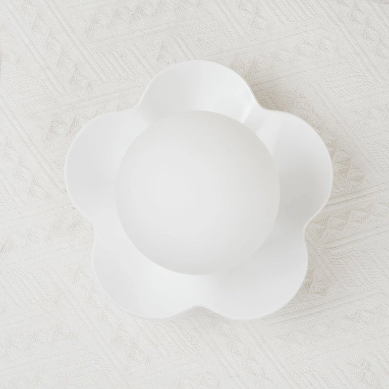Contemporary La Fleur wall sconce warm lighting hospitality retail design