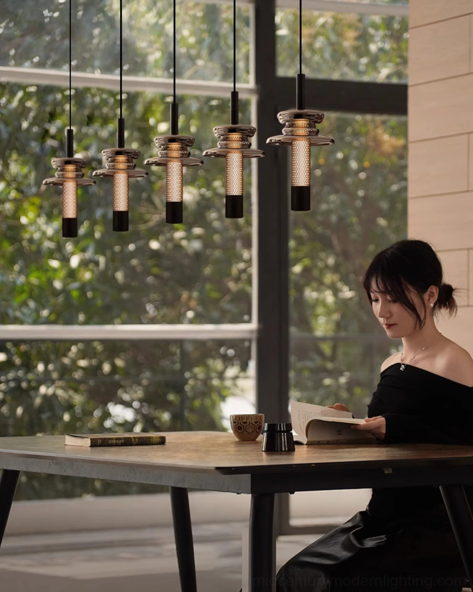 Float pendant lights illuminating modern dining area with natural wood table and sunlit interior