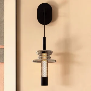 Modern Float wall sconce installed on beige accent wall - front close-up showing warm LED light emission