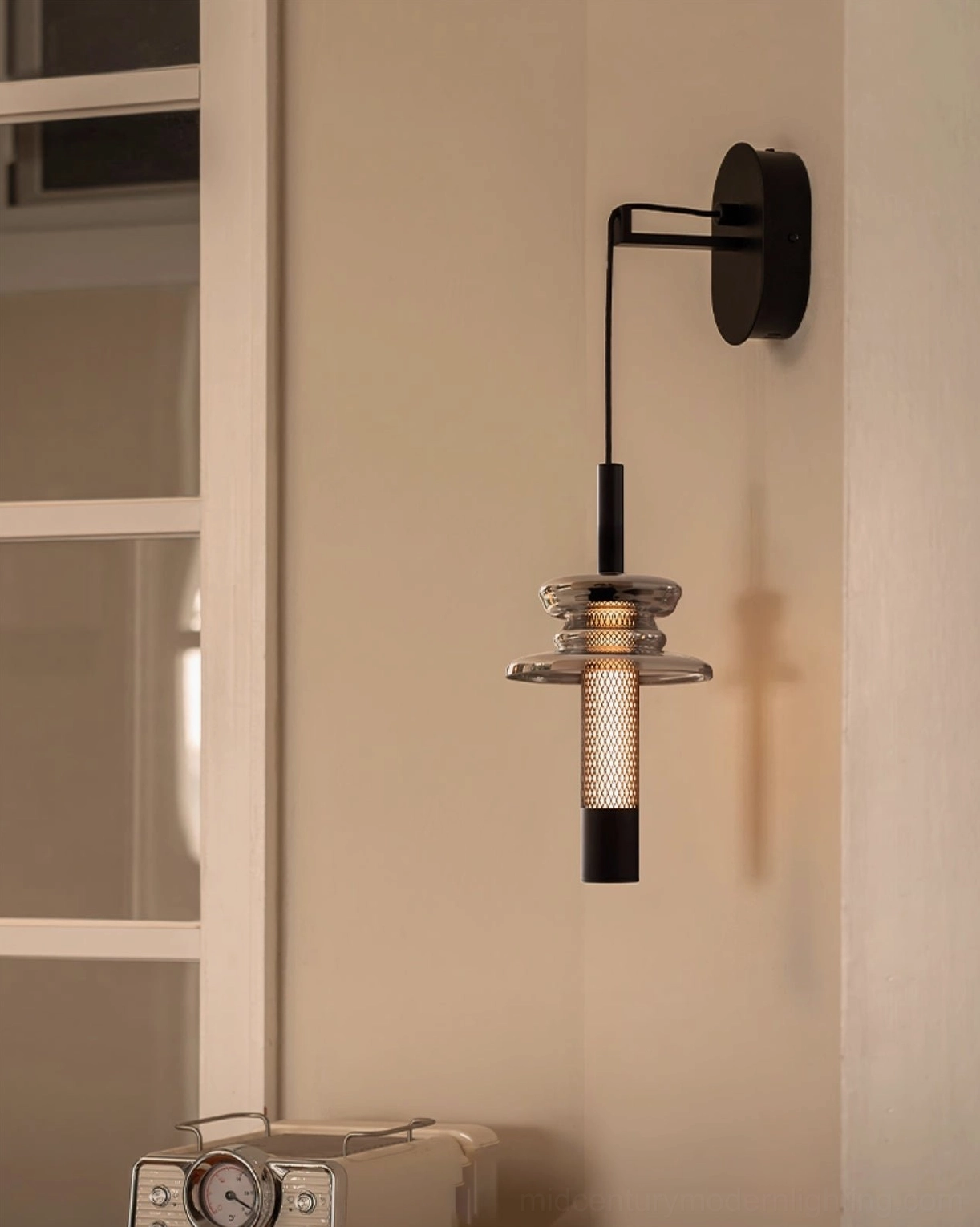 Float wall lamp with adjustable metal swing arm mount on modern home wall near window