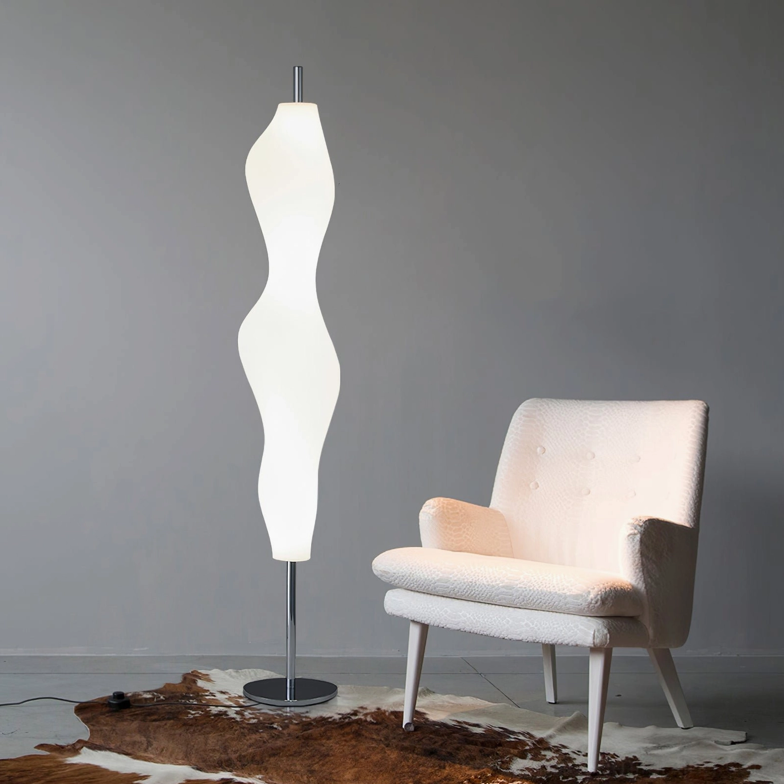 Modern biomorphic floor lamp creating soft ambient lighting in minimalist interior