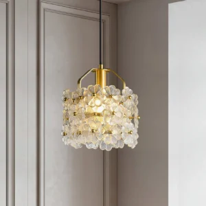 Modern floral glass pendant lamp hanging against minimalist gray wall with downward lighting angle