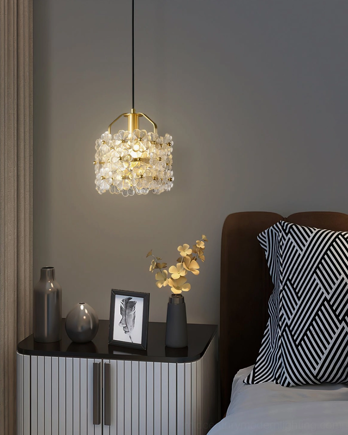 Modern brass floral glass pendant lamp suspension detail with wire and mounting hardware visible