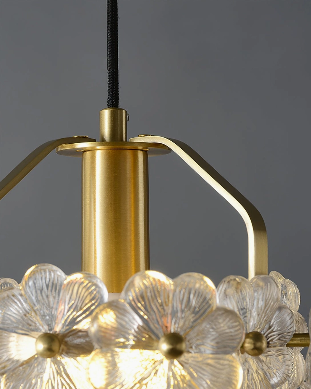Modern botanical pendant light fixture side profile highlighting translucent glass flower craftsmanship