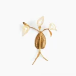 Florentine calla lily wall sconce with brass frame and clear glass shades against white background