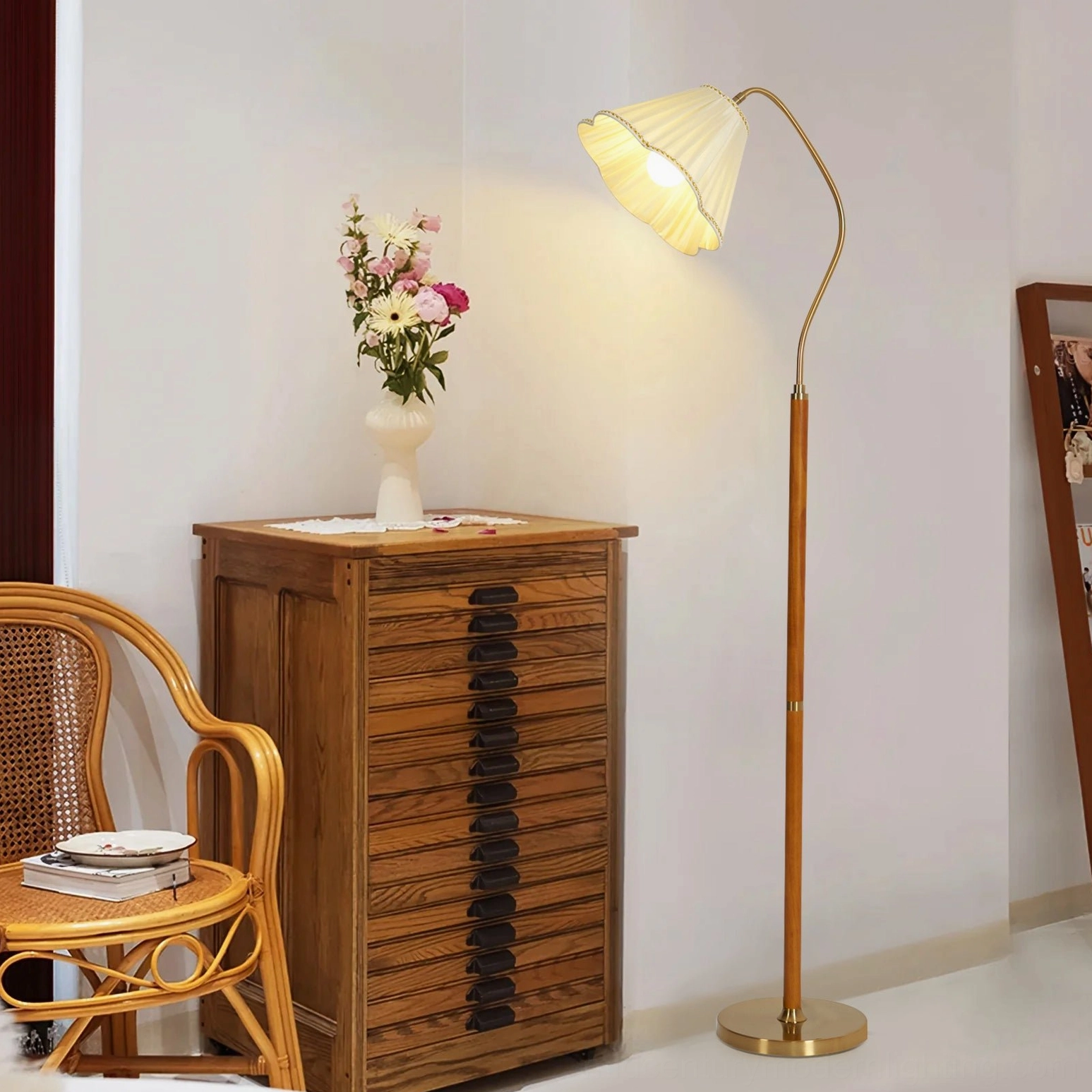 Florentine adjustable reading floor lamp three-quarter view in vintage living room with warm brass and wood tones