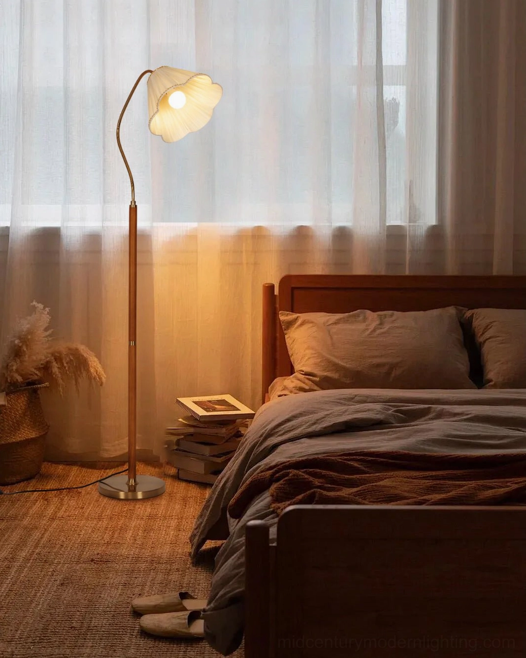 Florentine bedside floor lamp with fabric shade providing warm reading light in vintage bedroom setting