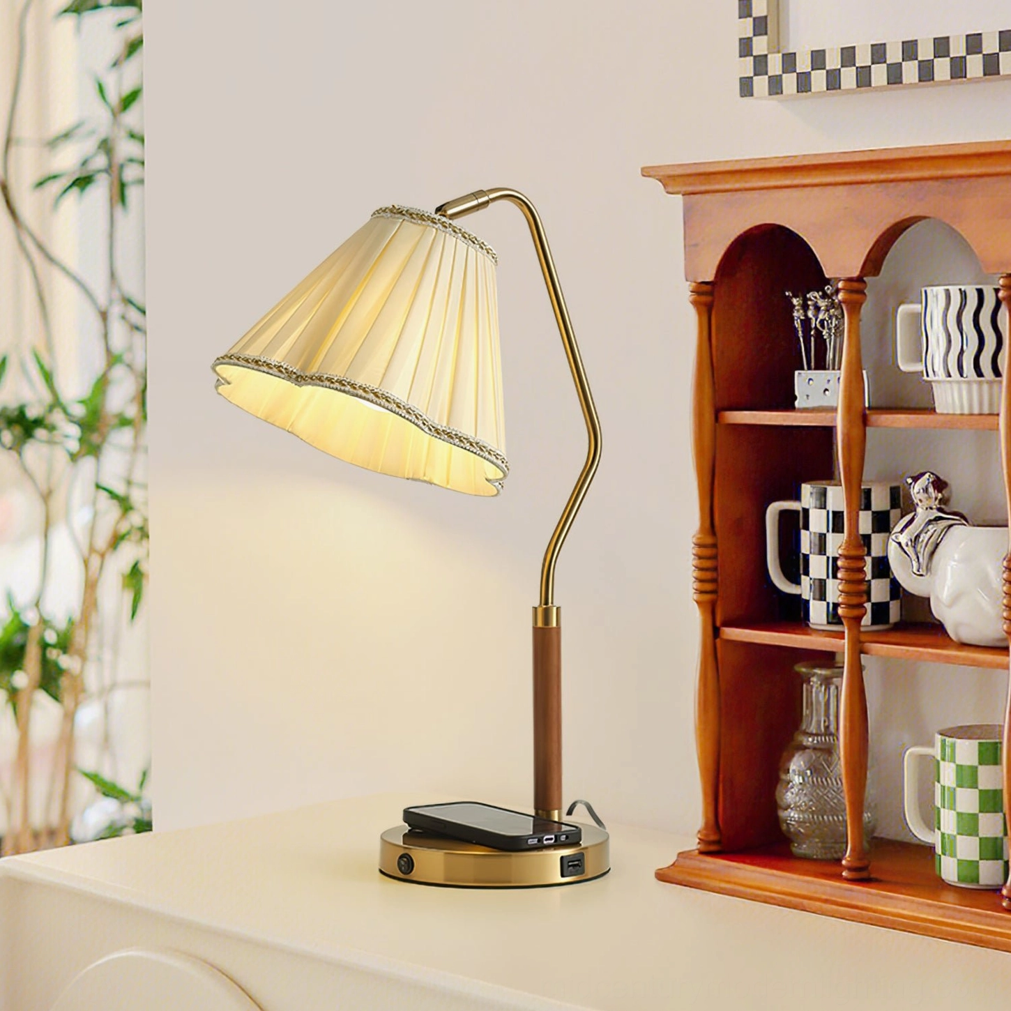Florentine desk lamp with wireless charging base, display cabinet area