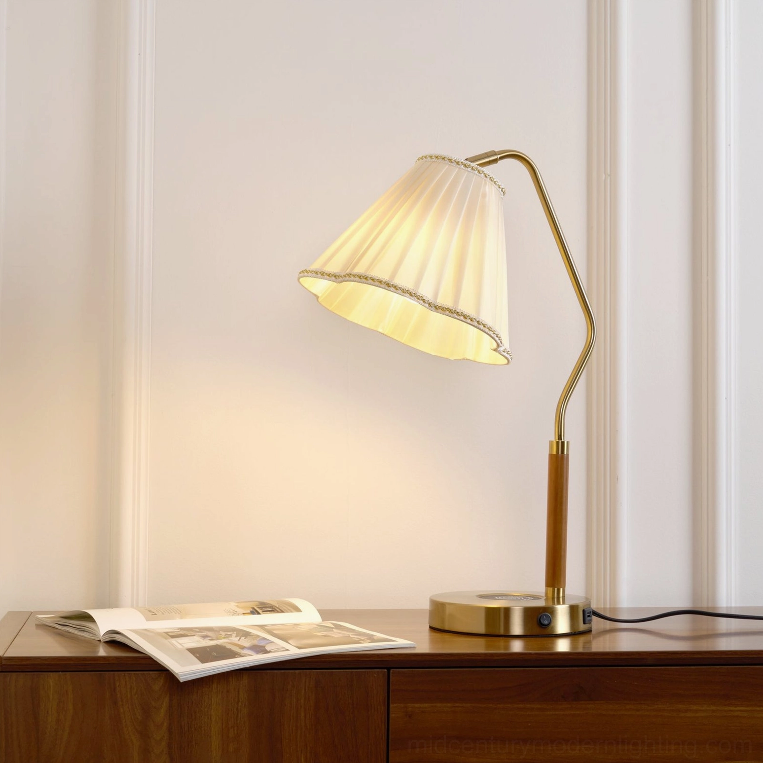 Florentine fabric lamp on wooden cabinet with magazine, living room styling