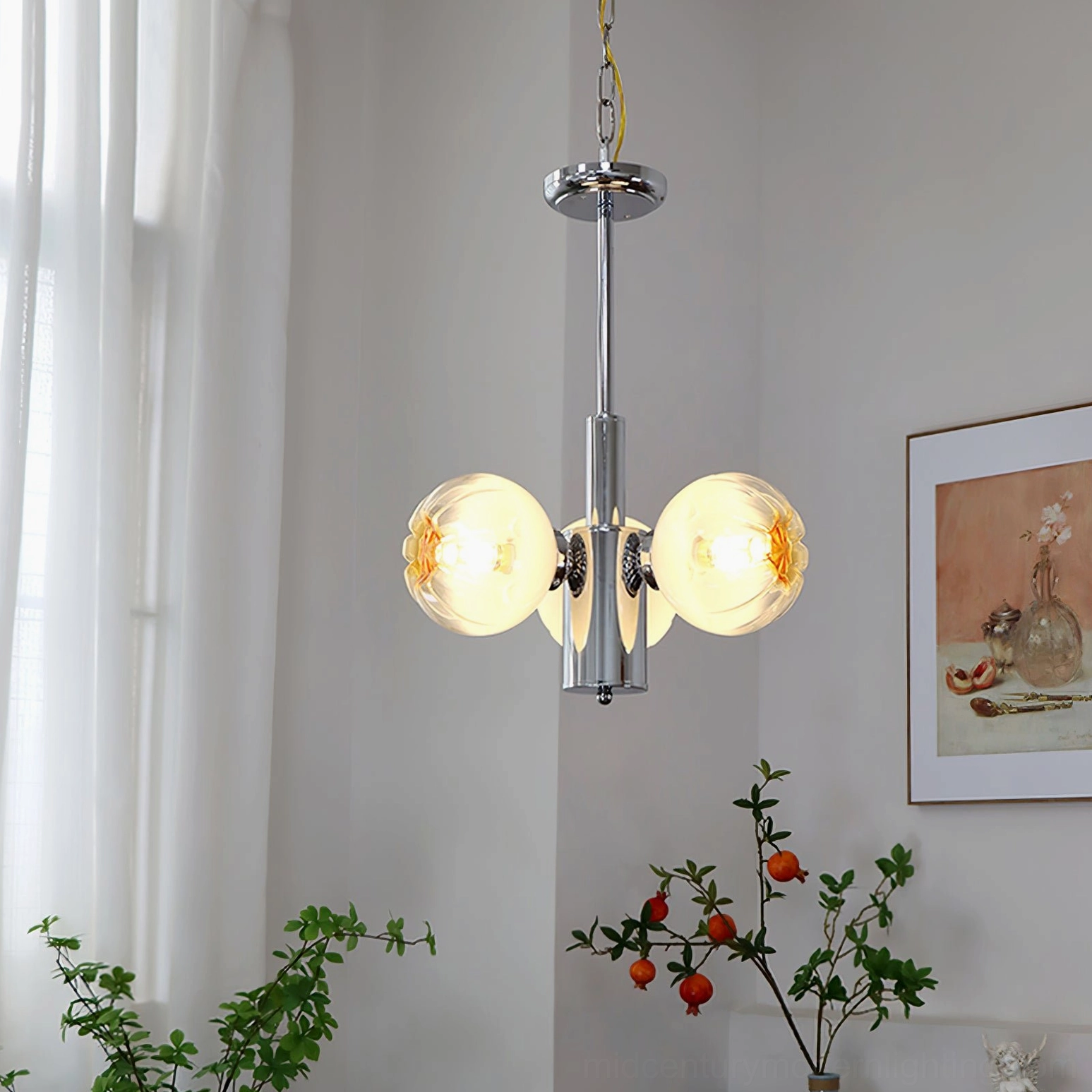 Detailed close-up of Flower Bud Chandelier's hand-finished amber glass shade and chrome hardware craftsmanship